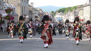 The Massed Bands - Scotland the Brave -  on the march after the 2019 Dufftown Highland Games in Mora